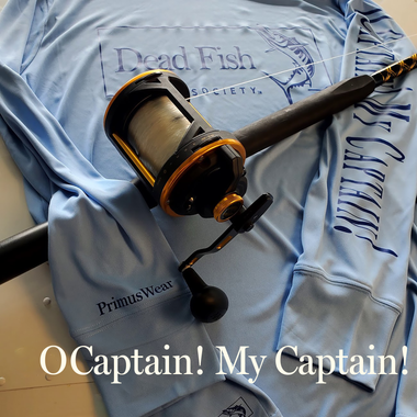 an image of the DFS o captain my captain perf offshore shirt and a penn rod and reel